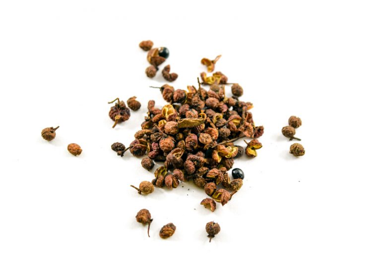 Sichuan or szechuan peppercorns isolated on white background. They numb the mouth when eaten.